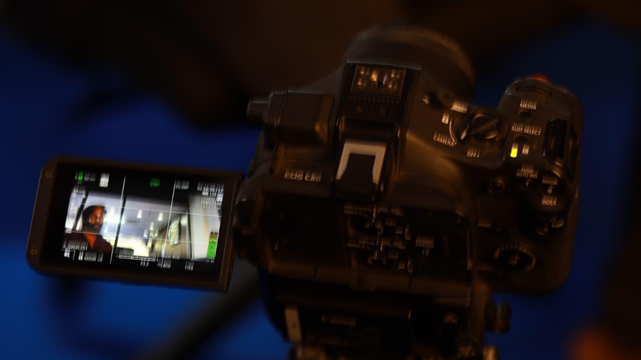 Filmmaker reviewing footage on a professional cinema camera
